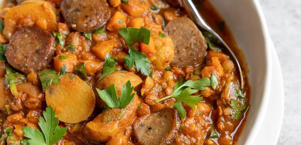 A bowl of Lentil, Potato, and Sausage Stew.