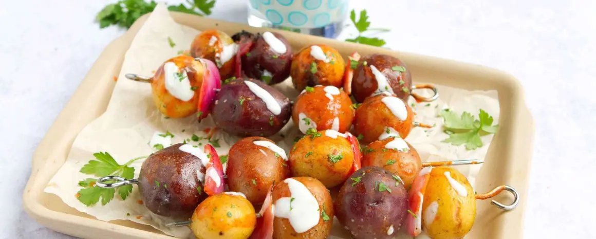 A plate of buffalo grilled potato skewers.