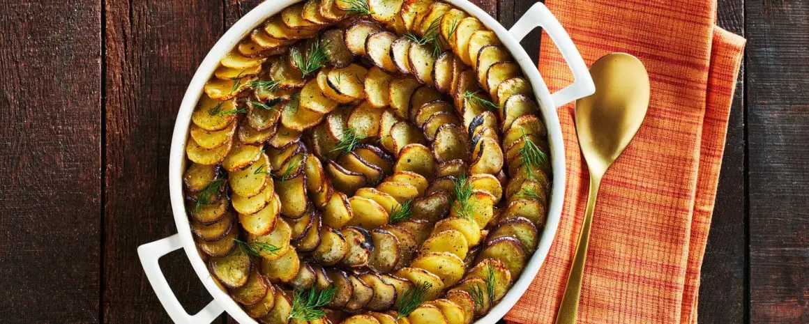 A casserole dish full of tuna potato pie.