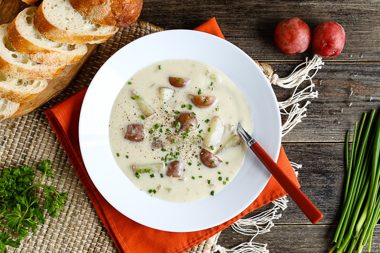 A vegan cream of potato soup in a bowl.