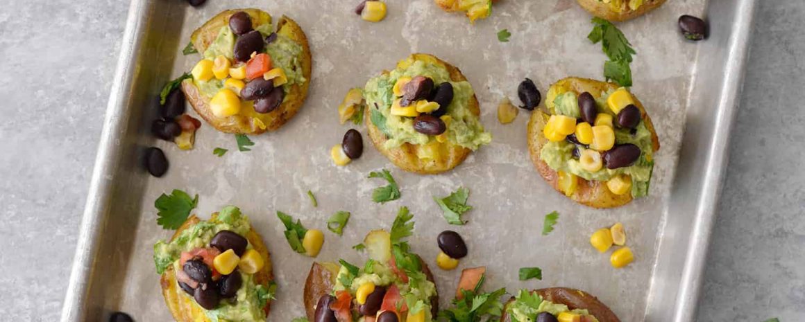 Vegan Loaded Smashed Potatoes on a baking sheet