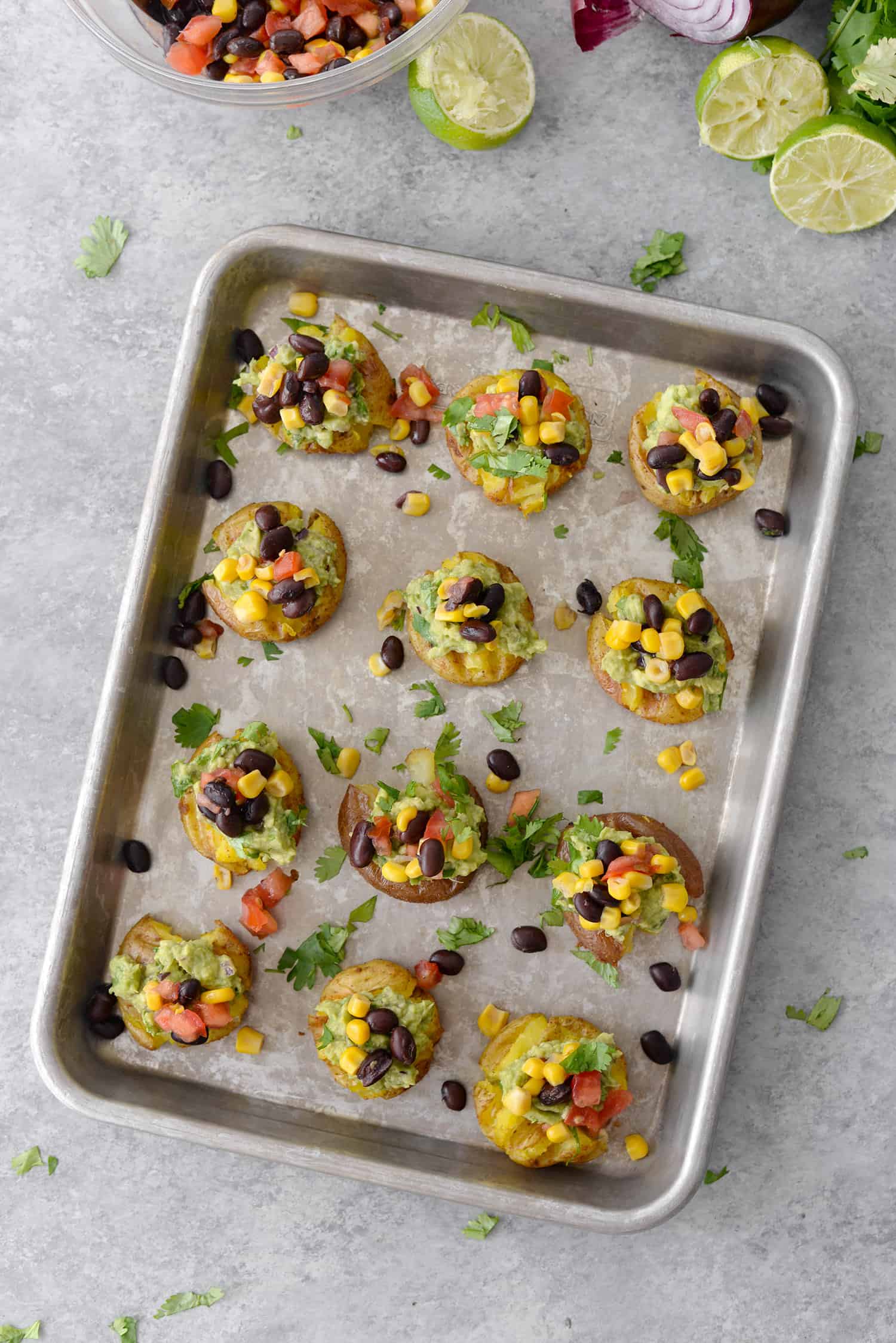 Vegan Loaded Smashed Potatoes on a baking sheet