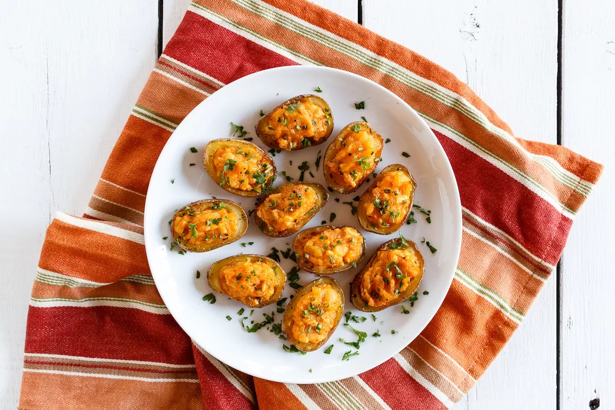 A plate of vegan double stuffed buffalo ranch potatoes.