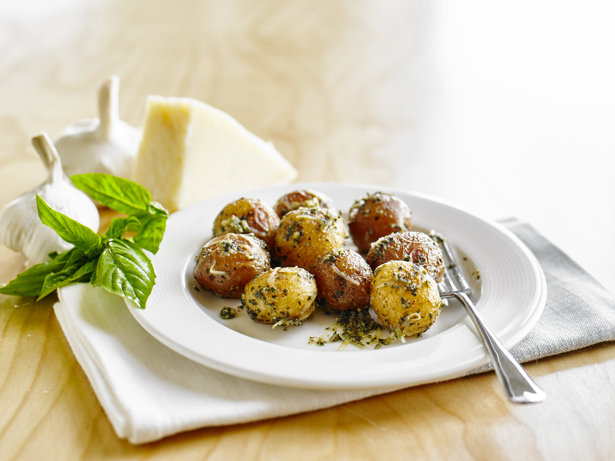 A plate of pesto Parmesan roasted potatoes.