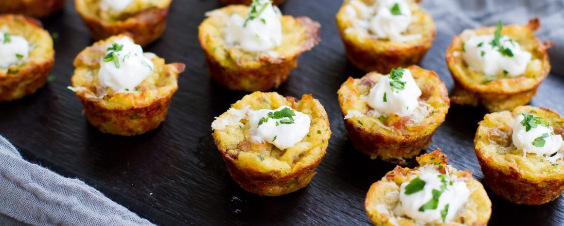 Baked mashed potato bites on a little serving dish.