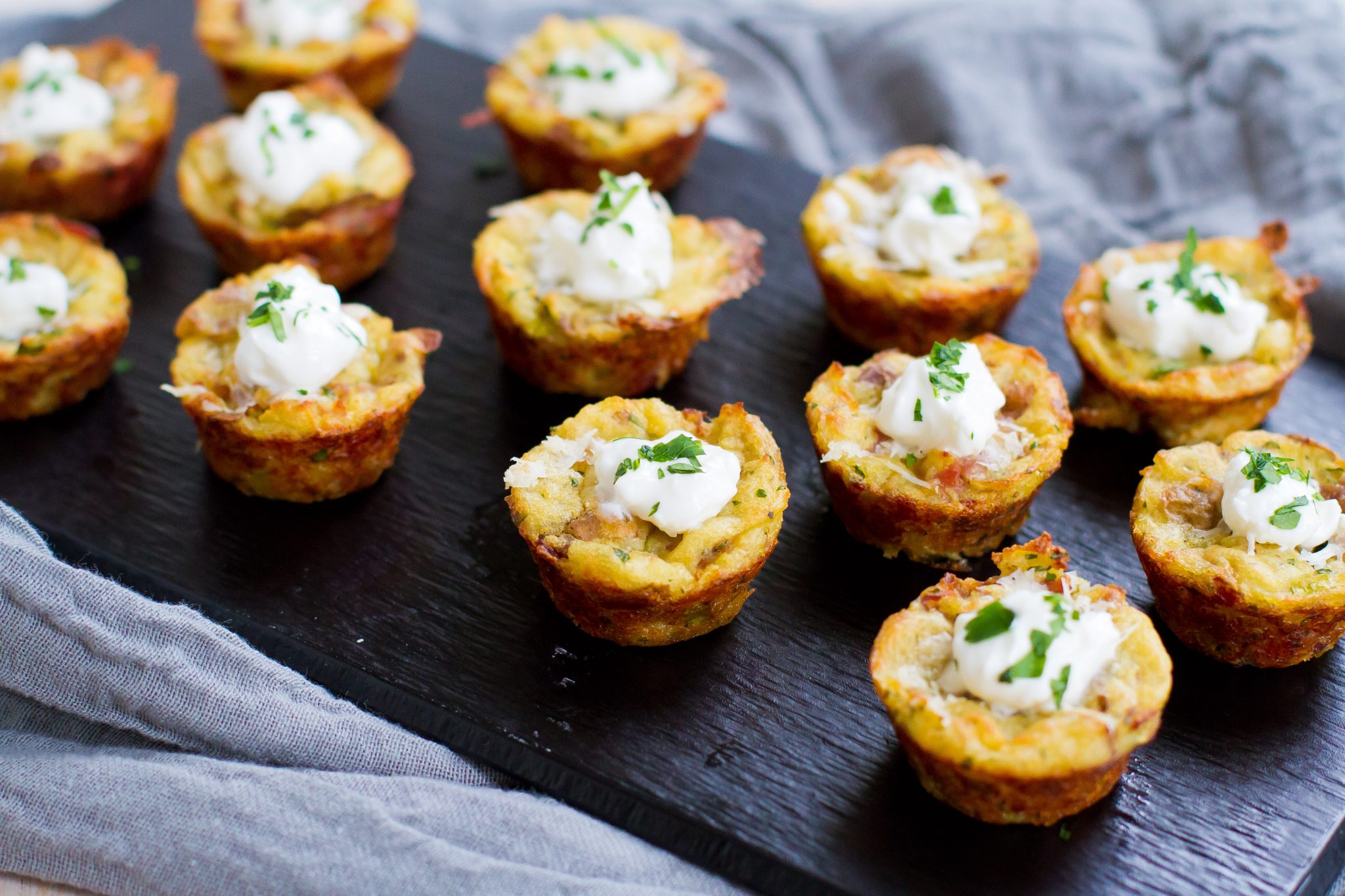 Baked mashed potato bites on a little serving dish.