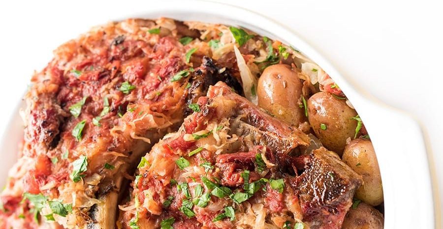 Baked pork chops with sauerkraut and potatoes.