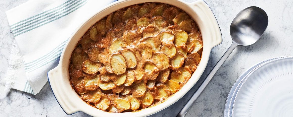 A casserole dish of basic scalloped potatoes.