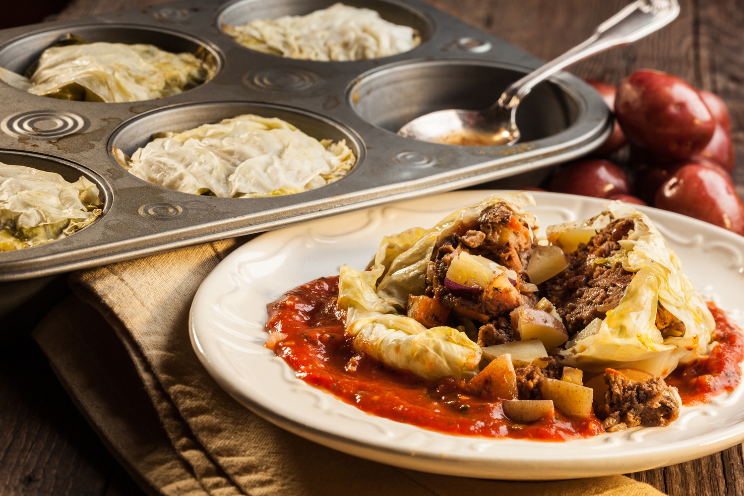 A plate of cabbage rolls made in a muffin tin.