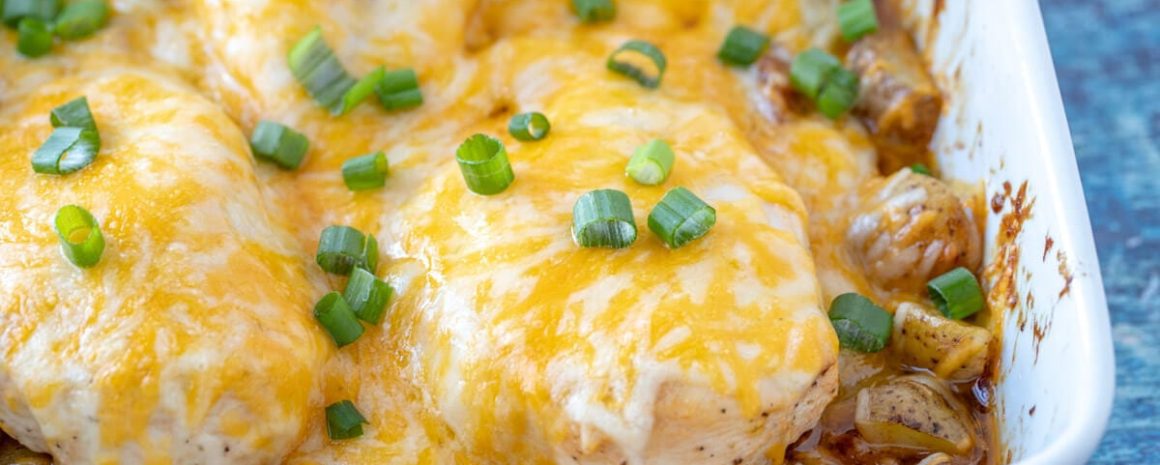 A plate of cheesy barbecue bacon ranch chicken and potatoes.