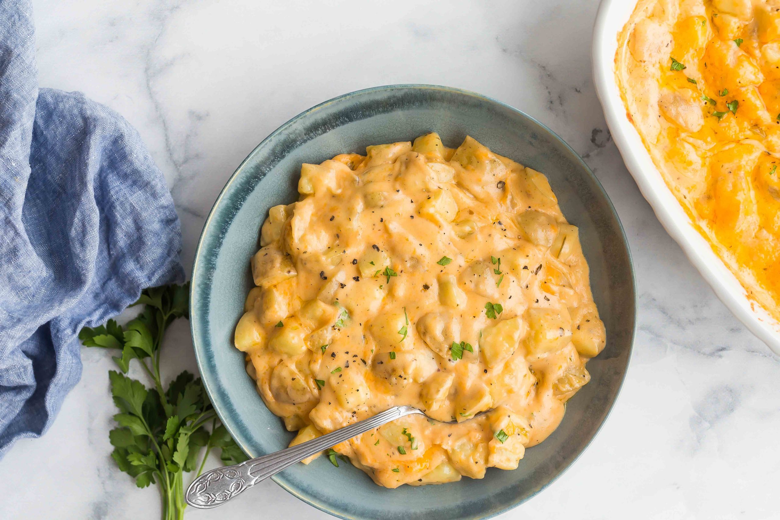 A bowl of cheesy potato casserole. The cheesiest you've ever had.