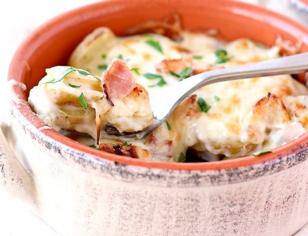 A container of chicken cordon bleu scalloped potatoes.