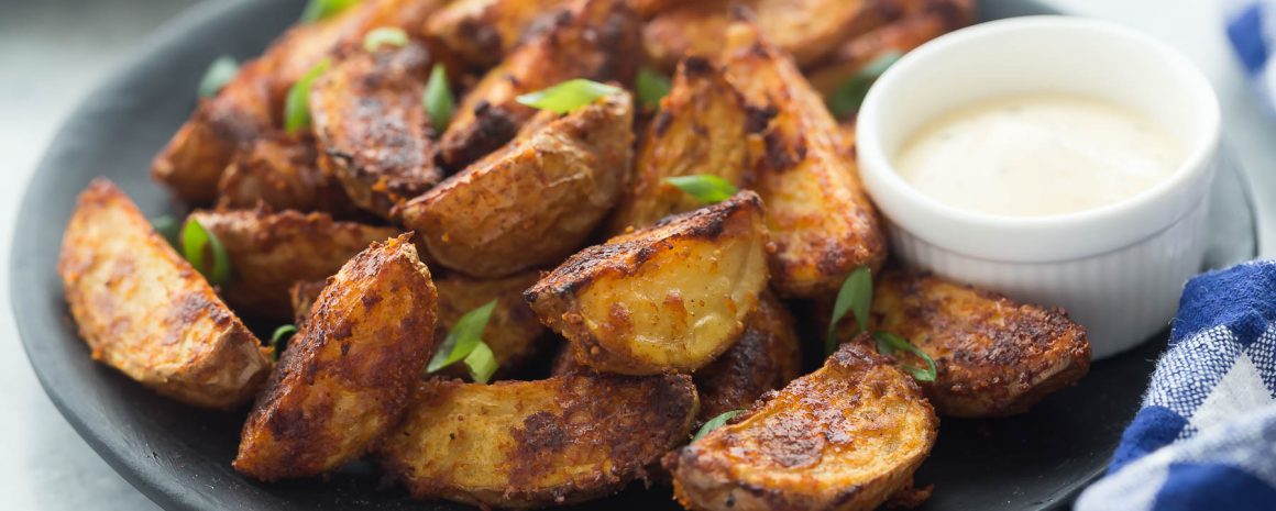 A plate of chipotle Parmesan potato wedges.