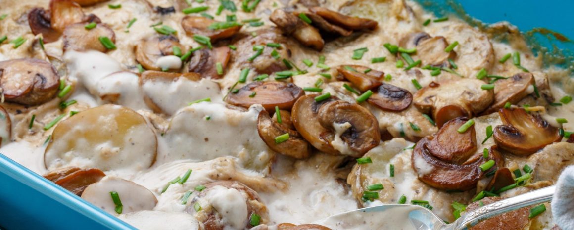 Cream of mushroom soup potatoes in a casserole dish.