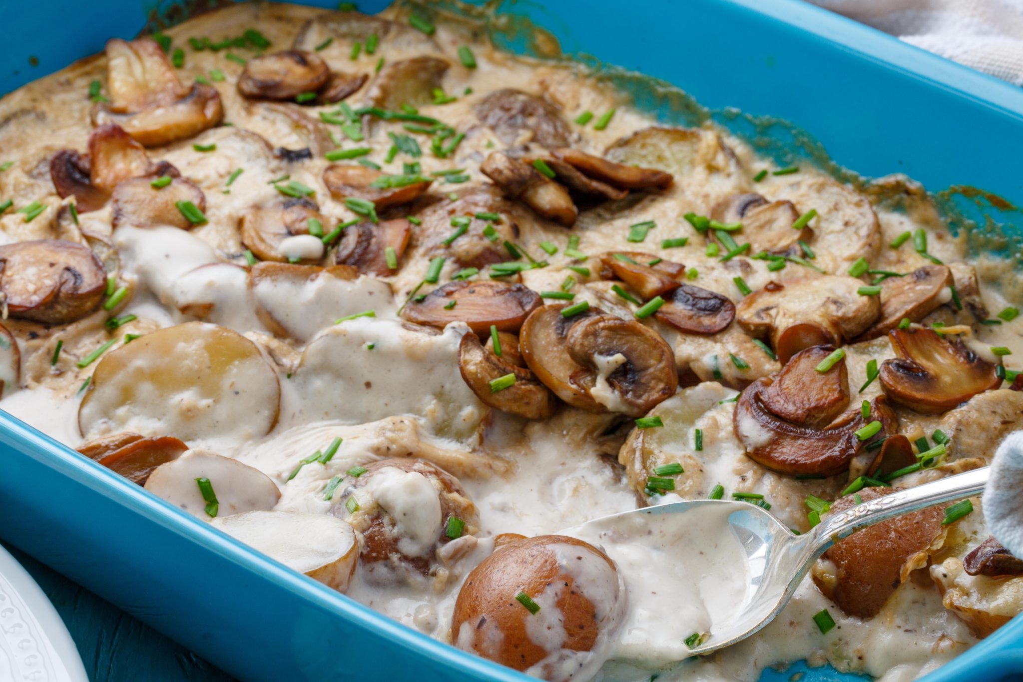 Cream of mushroom soup potatoes in a casserole dish.