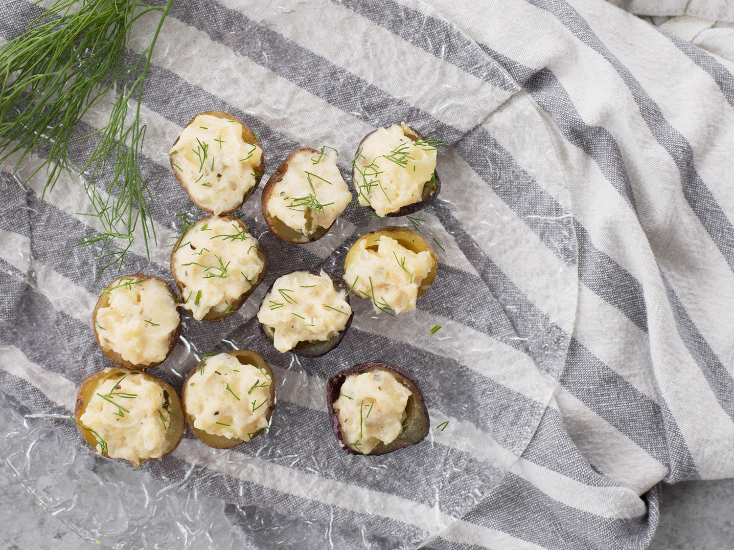 Devilled potatoes on a glass plate.