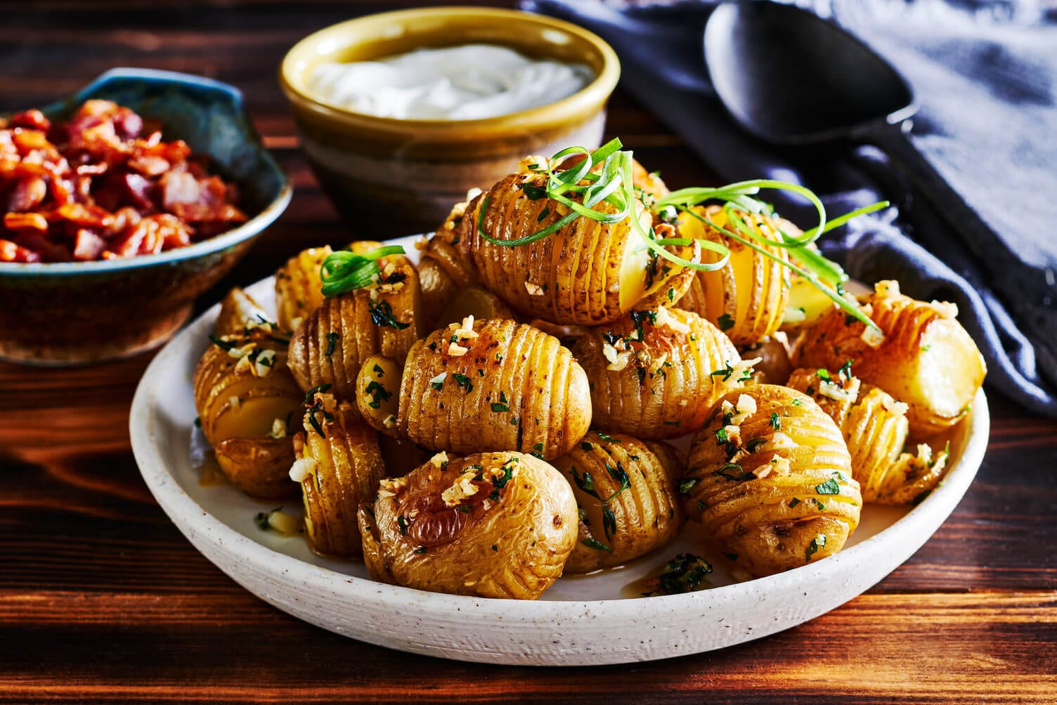 A triumphant plate of garlic thyme hasselback little potatoes.