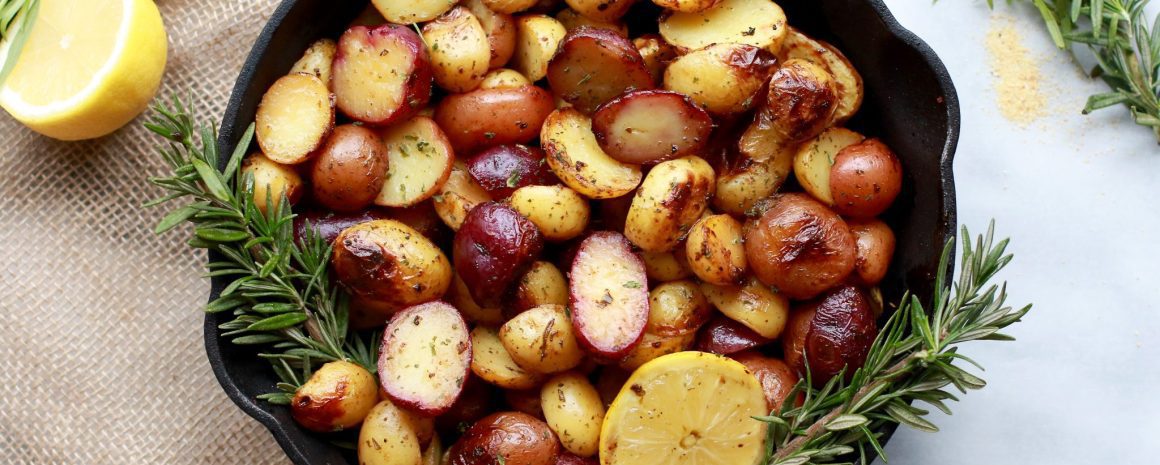 A cast iron pan of potatoes with lemon.