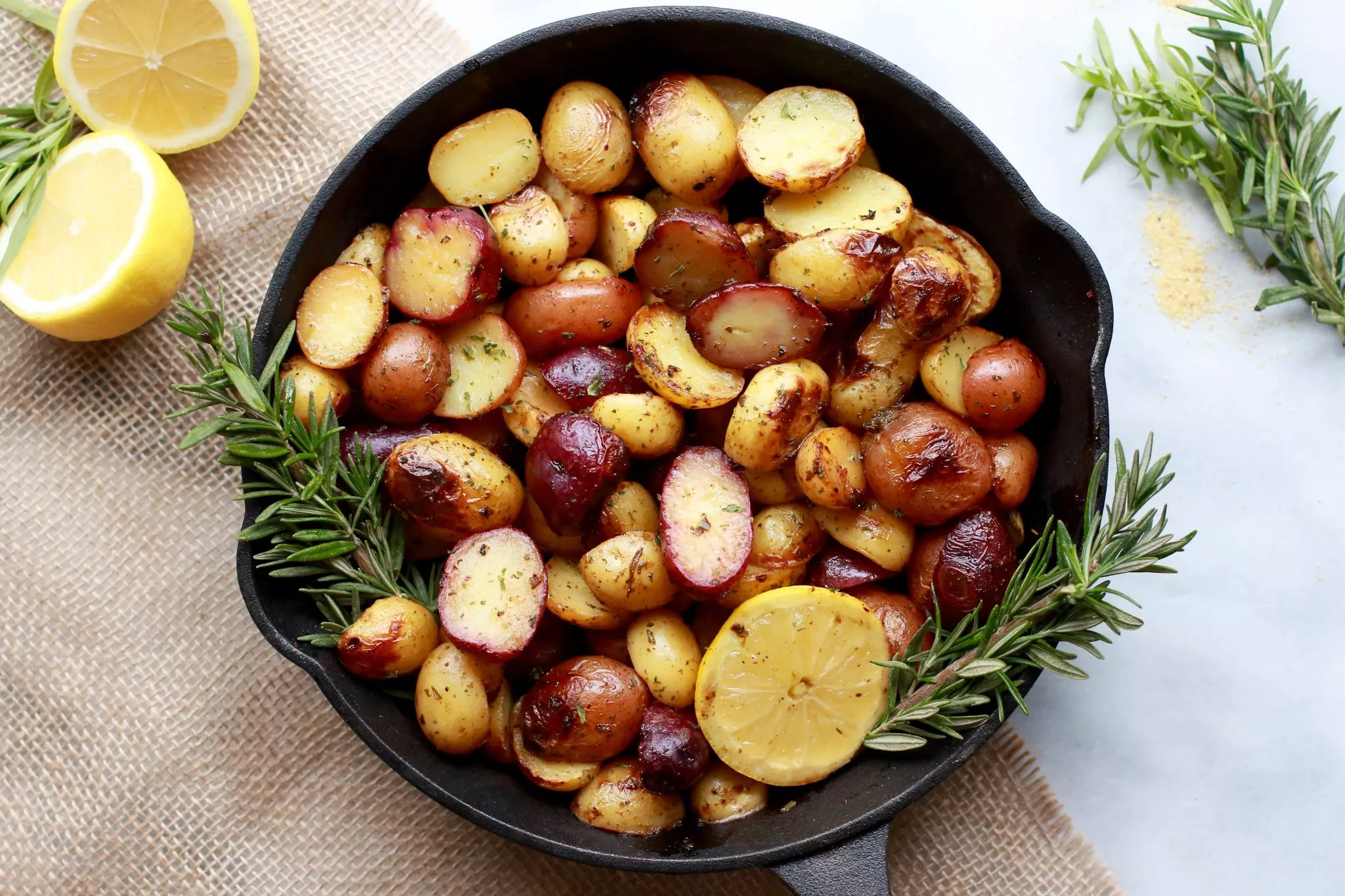 A cast iron pan of potatoes with lemon.