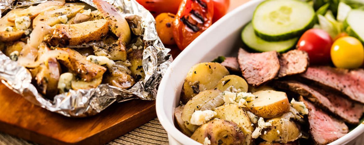 Serving bowl with foil and veggies inside.