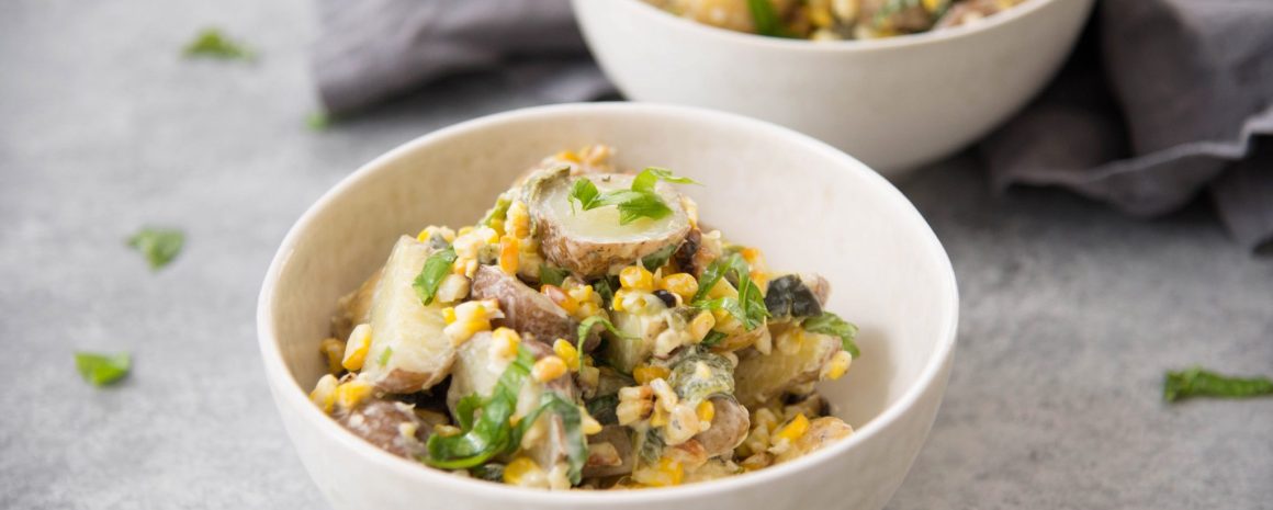 Bowls of grilled corn and poblano potato salads.