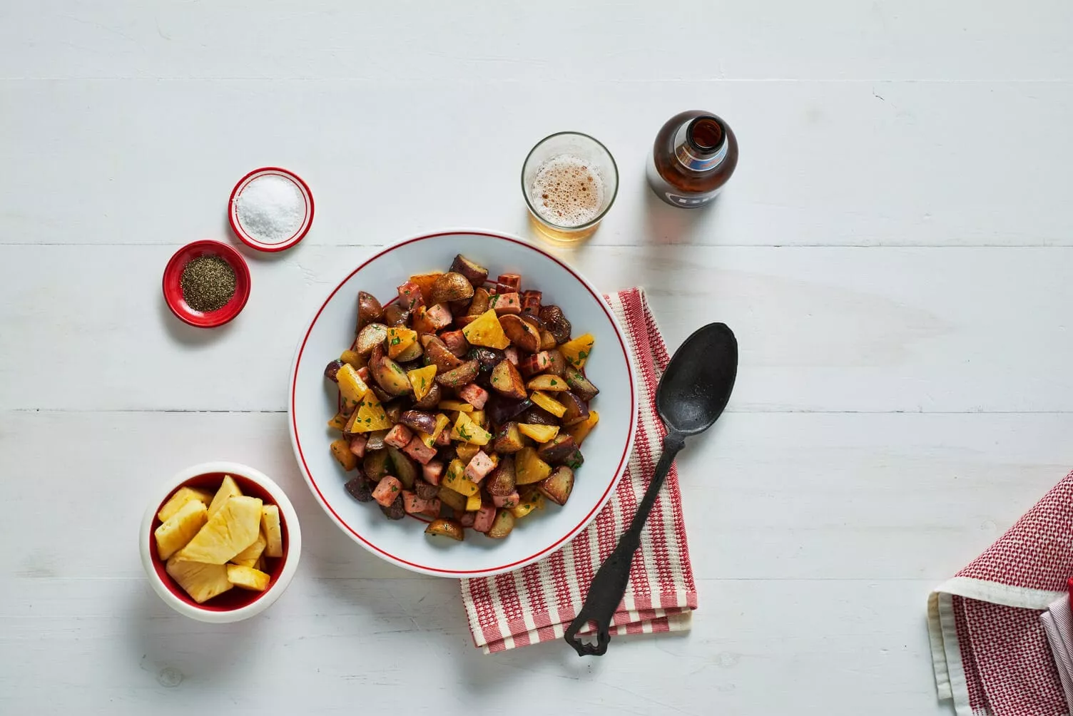 Ham-and-Pineapple-Roasted-Little-Potatoes_The-Food-Group_Web-Res-1 A bowl of ham and pineapple pan-fried potatoes.