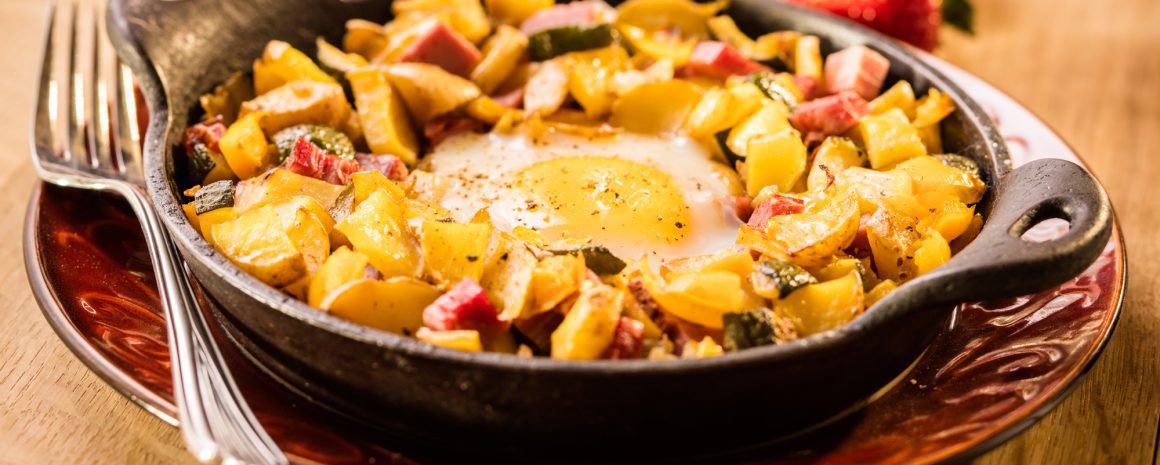 A skillet of hash brown casserole.