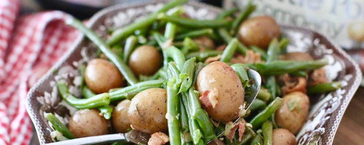 a bowl of Instant Pot Southern green beans with potatoes and bacon.