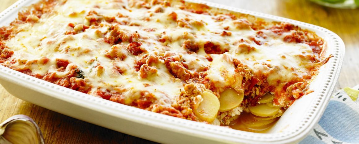 Creamy potato lasagna in a casserole dish.