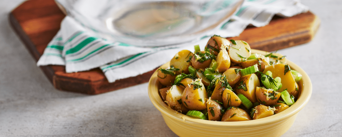 A bowl of lemon herb potato salad.