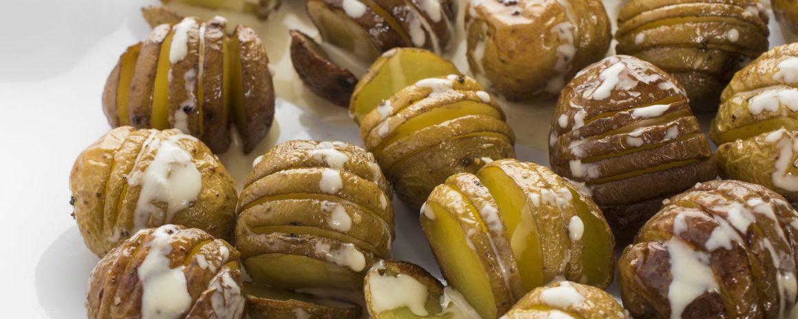 Hasselback potatoes with tahini sauce.