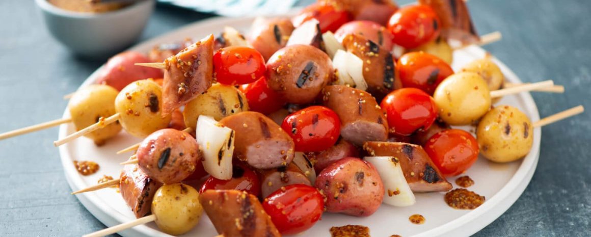 A plate of little potato brat skewers.