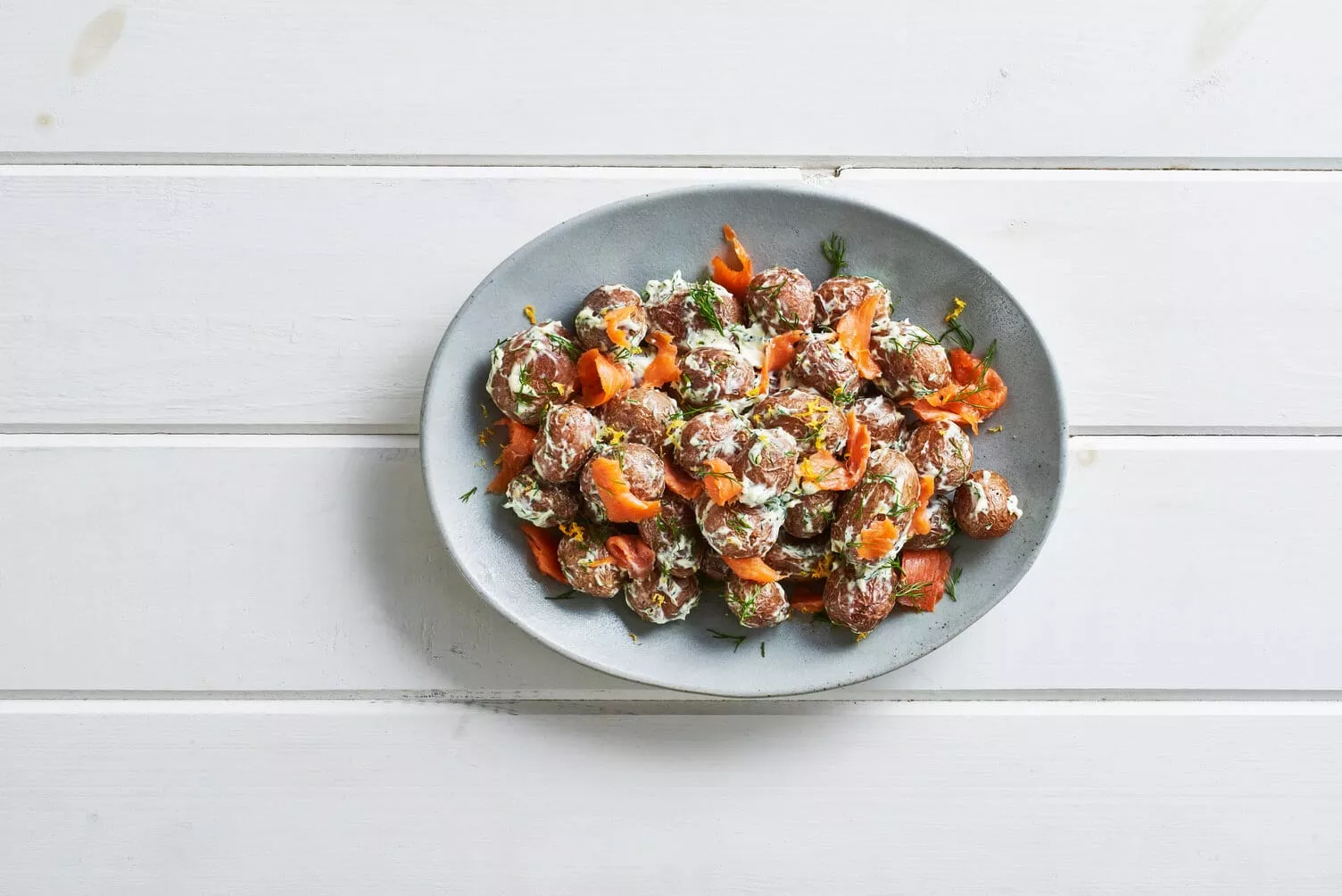 Lox-and-Cream-Cheese-Roasted-Potatoes_The-Food-Group_Web-Res-1 Smoked salmon lox roasted potatoes in a nice little platter.