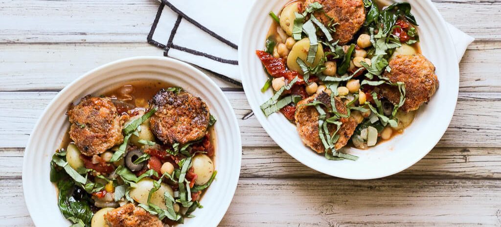 Two bowls of Mediterranean meatball stew.