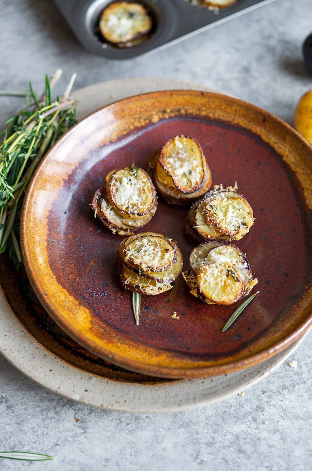 a plate of mini herbed potato stacks.