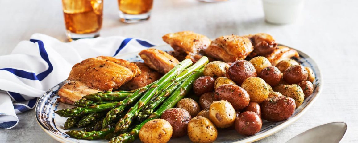 One pan chicken thighs and potatoes with a little asparagus on the side.