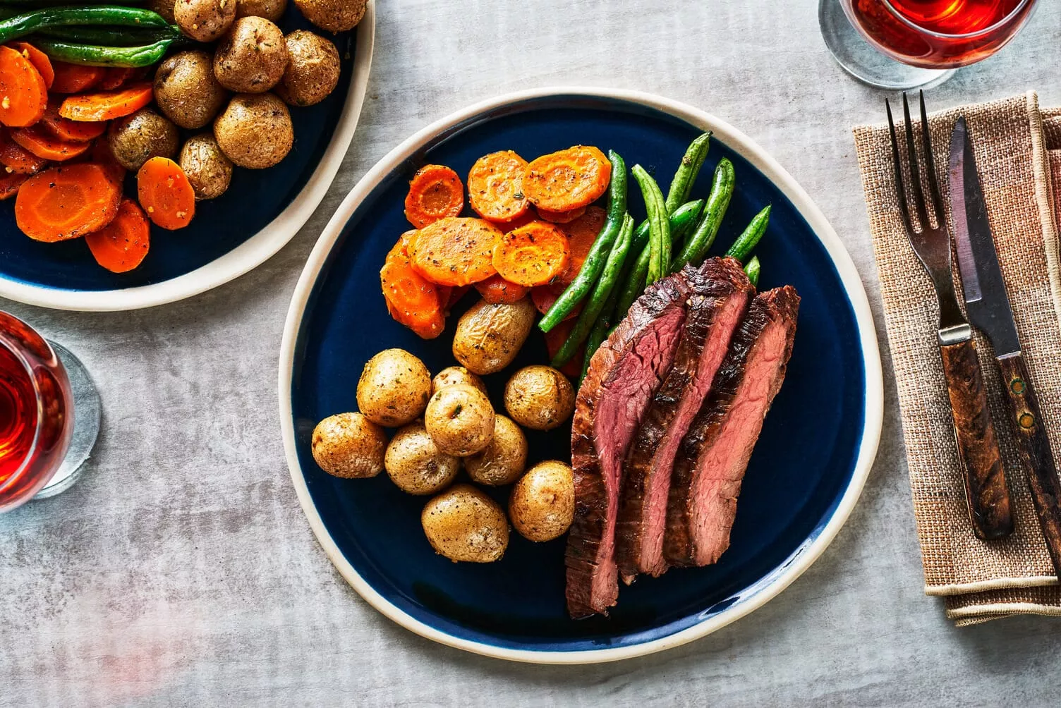 Onion-and-Chive-Potatoes-with-Flank-Steak_The-Food-Group_Web-Res-1 A nice full plate of flank steak, little potatoes, carrots, and beans.