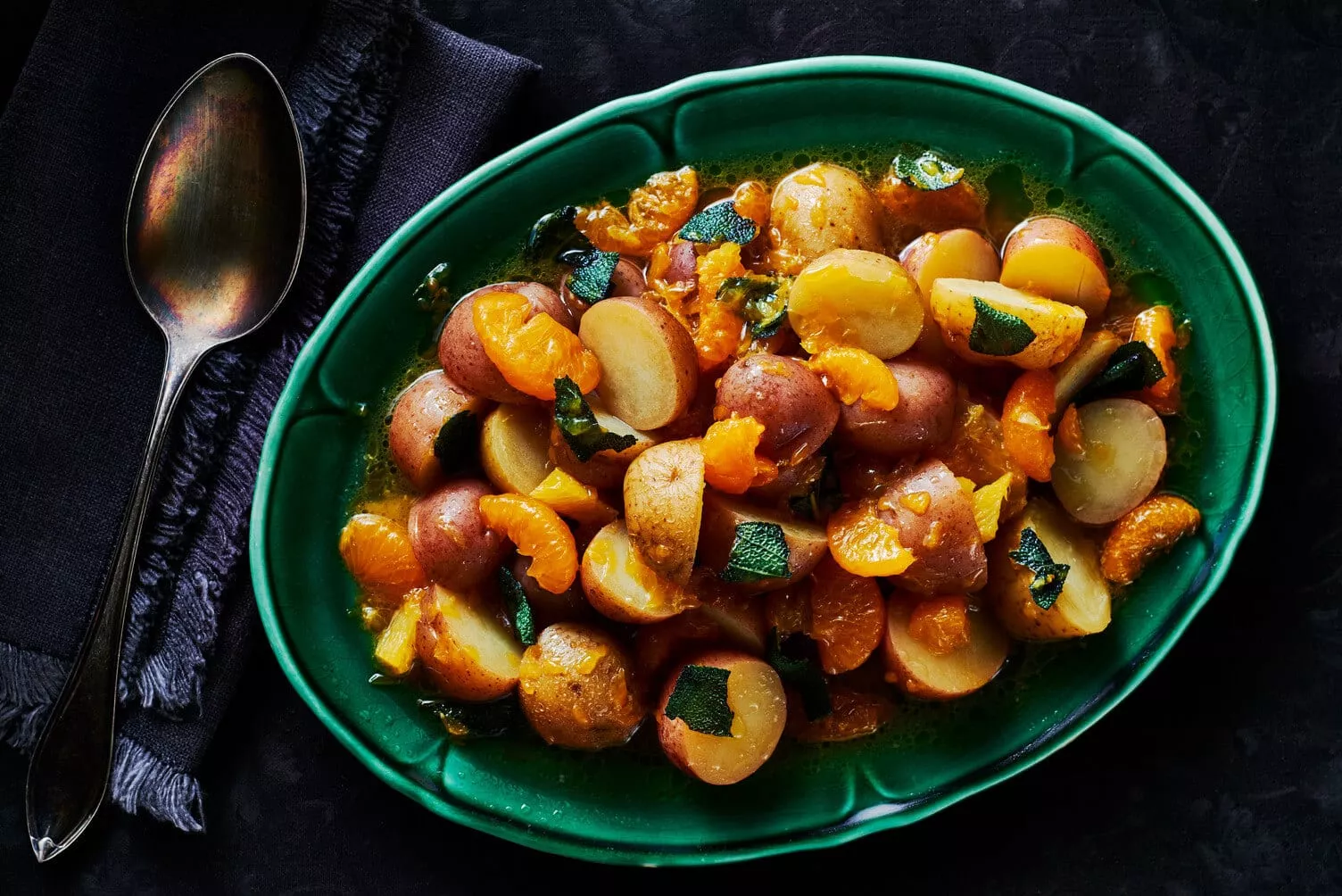 Orange-and-Sage-Poached-Potatoes_The-Food-Group_Web-Res-1 A tasty plate of sage and orange poached potatoes.