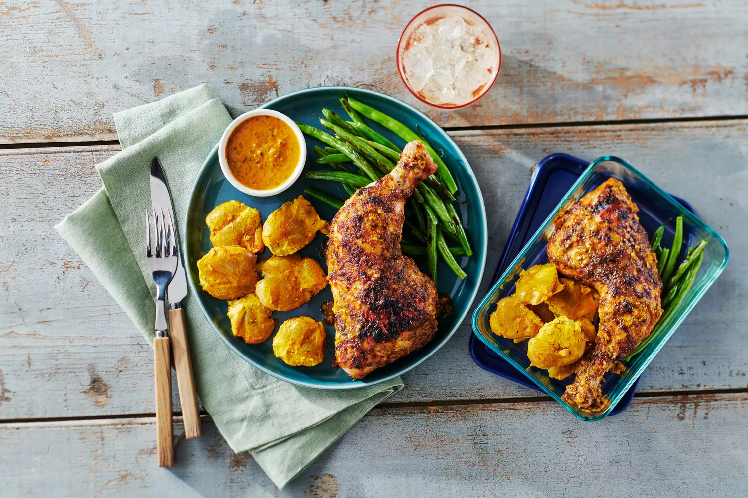 Piri-Piri-Chicken-with-Tandoori-Potatoes-and-Green-Beans_The-Food-Group_Web-Res-1 A plate of piri piri chicken and green beans with little potatoes.