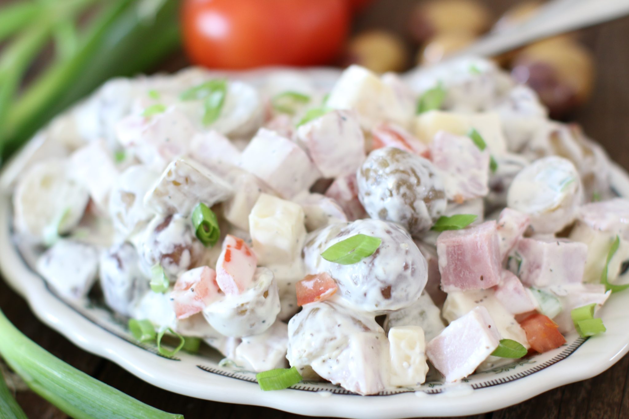 A bowl of potato and ham salad.