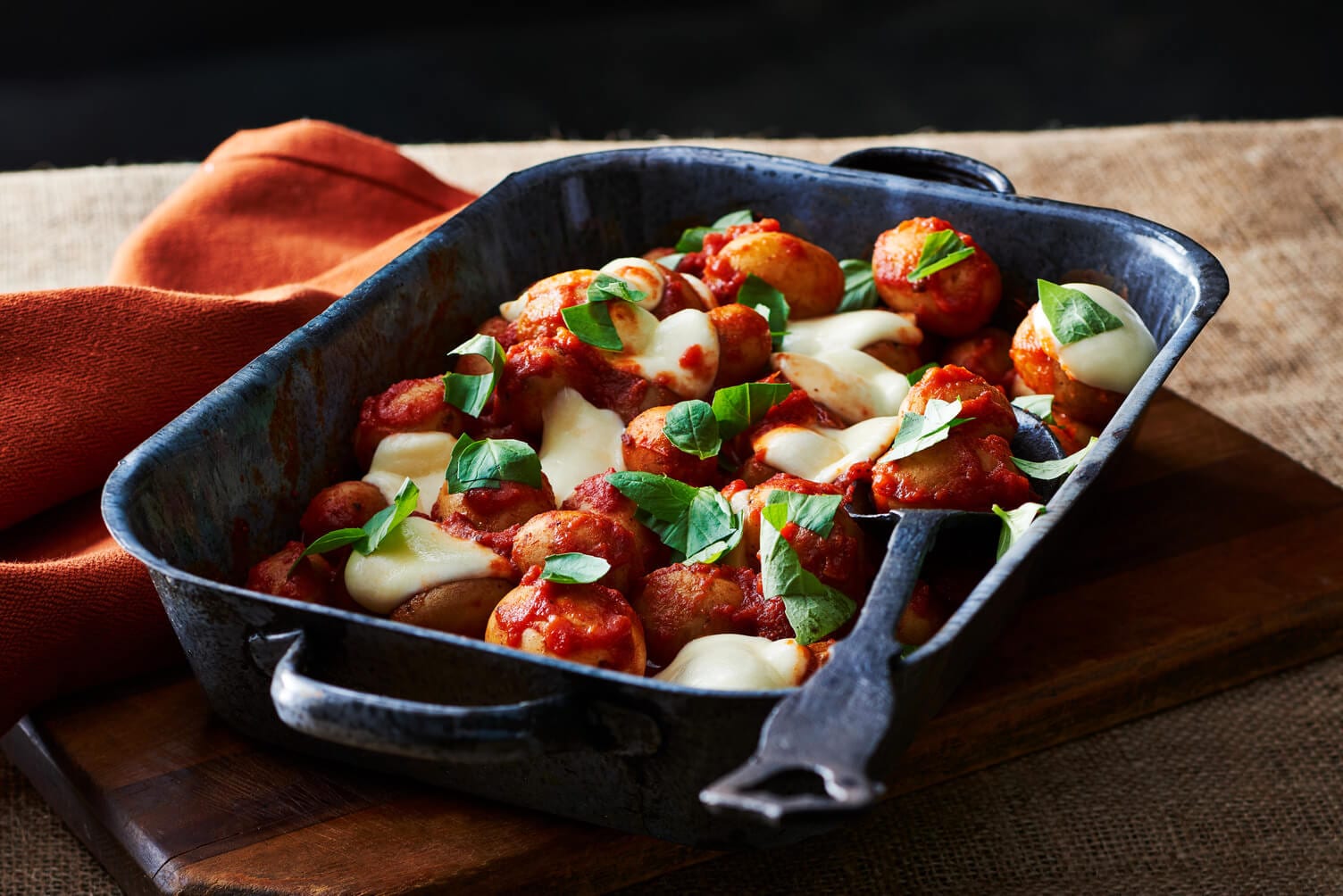 Potatoes poached in tomato sauce.