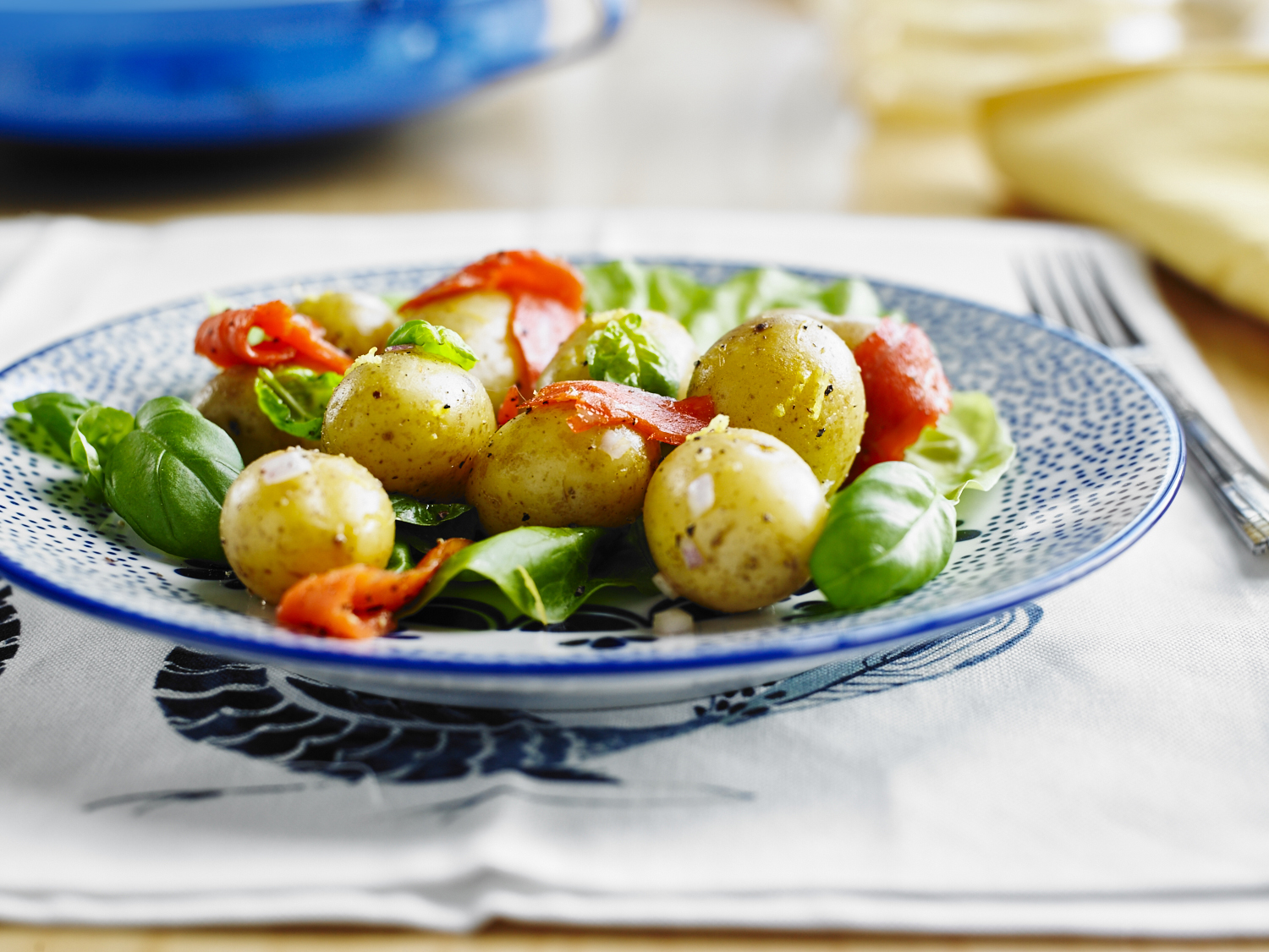 Potatoes with smoked salmon and basil.