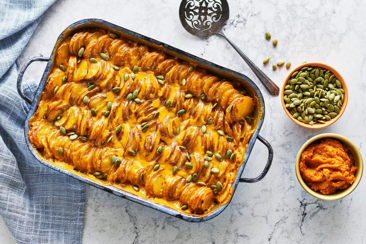 Pumpkin-Scalloped-Potatoes_The-Food-Group_Web-Res-1 A nice baking dish of pumpkin scalloped potatoes.