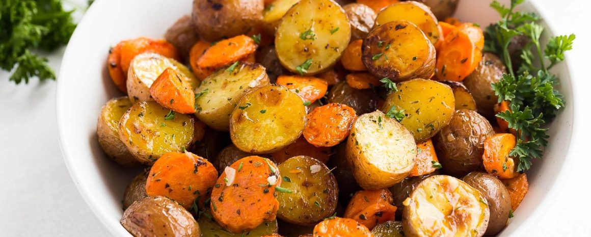 A bowl of roasted potatoes and carrots.