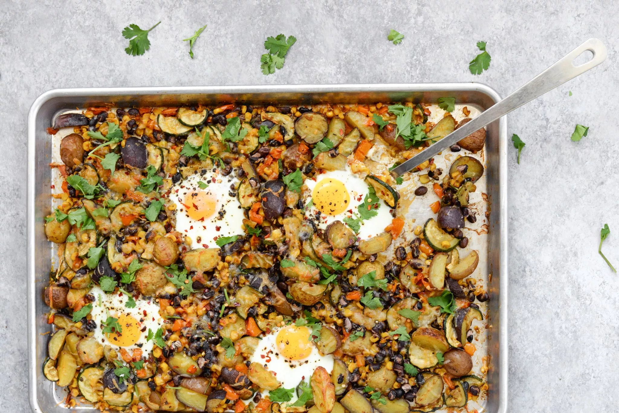 A sheet pan breakfast with potatoes.