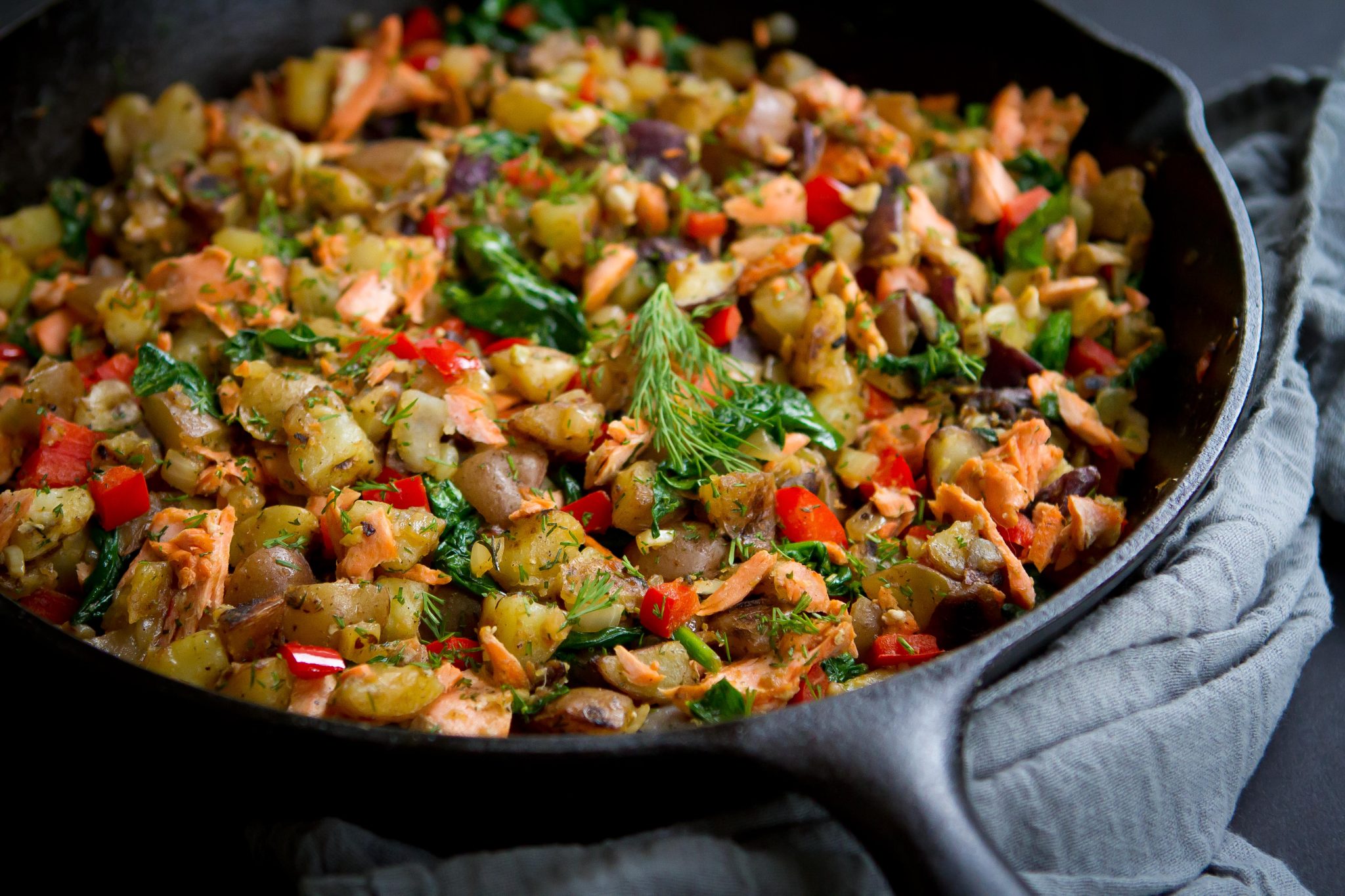 A salmon hash made in a cast iron skillet.