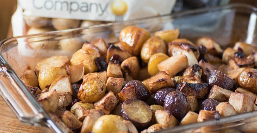 Slow roasted veggies in a glass baking dish.