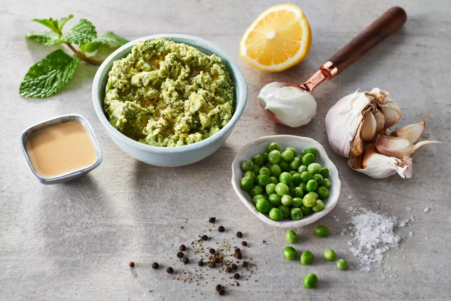 Smashed-Potatoes-with-Green-Peas-and-Mint-Dip_The-Food-Group_Web-Res-1 A bowl of green peas and mint dip to serve with smashed potatoes.