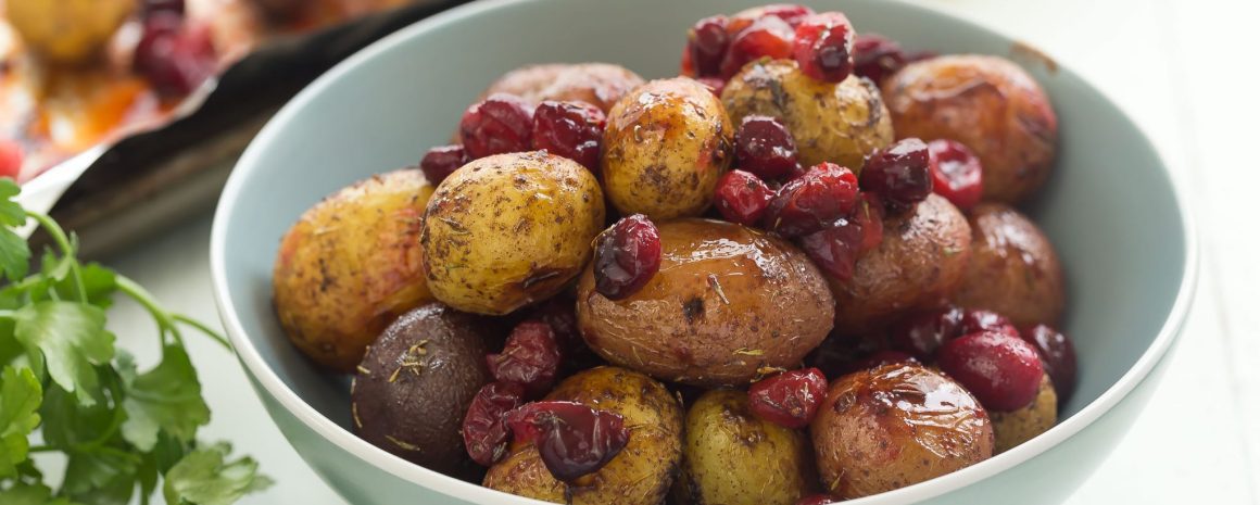 Roasted little potatoes with cranberries and spices. A wonderful side dish for the holidays!