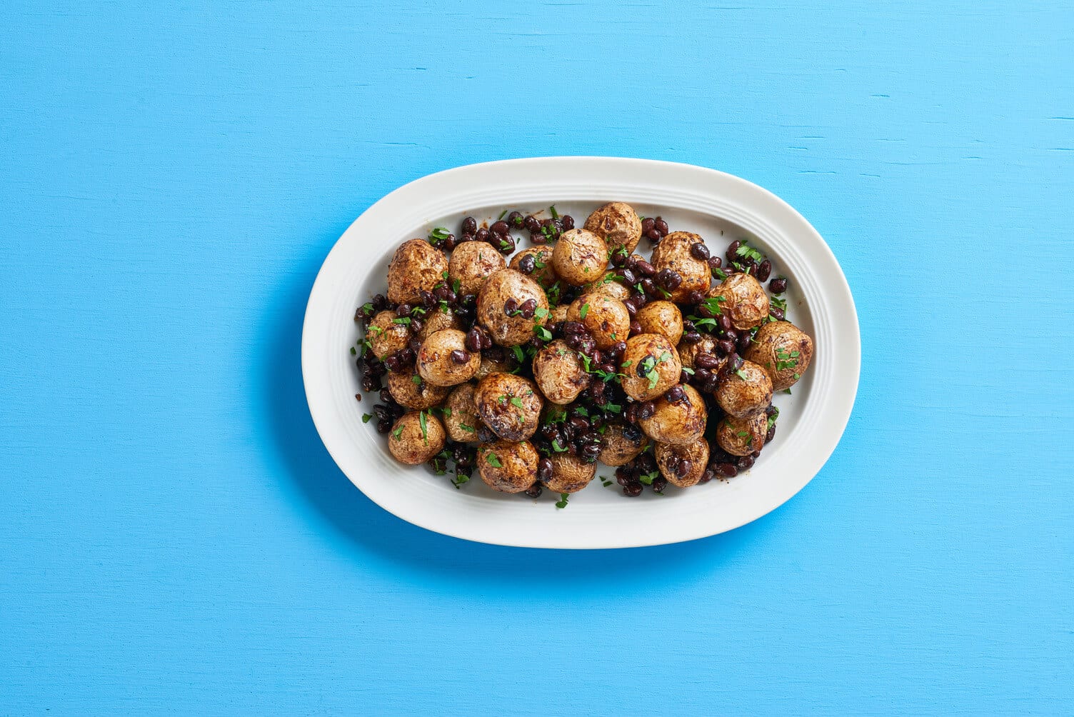 A plate of spicy black bean roasted potatoes